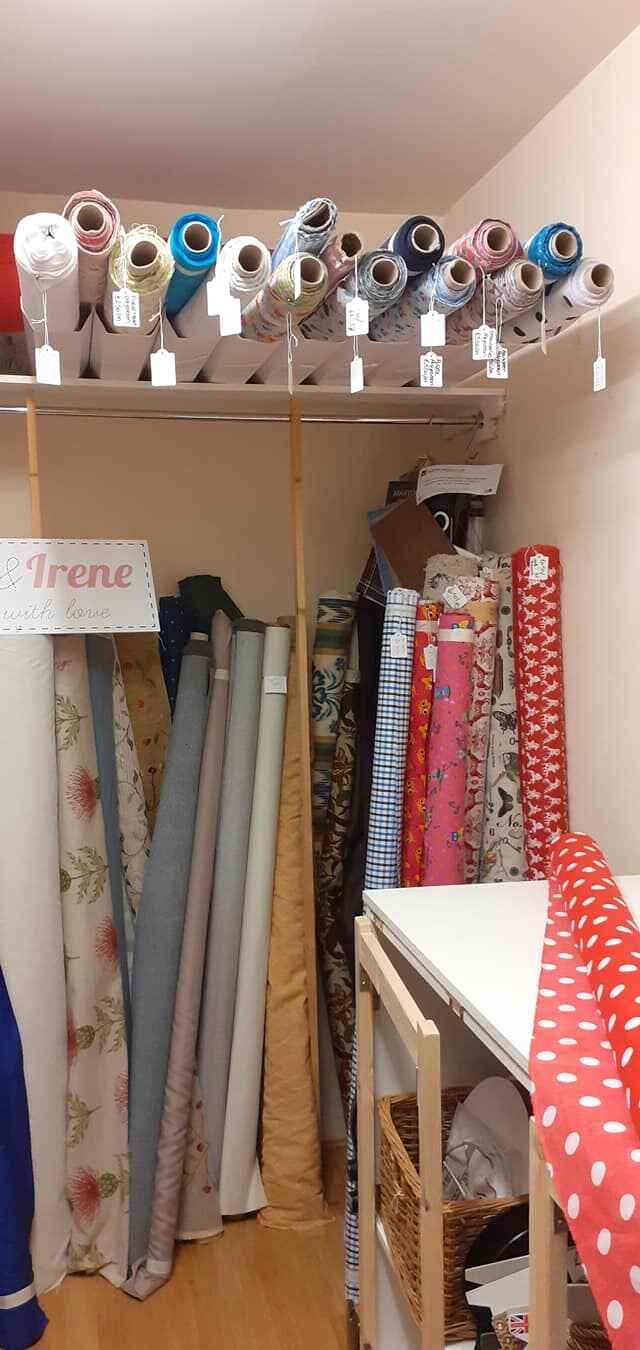 Large rolls of fabric in a corner inside Higglety Pigglety. Photo