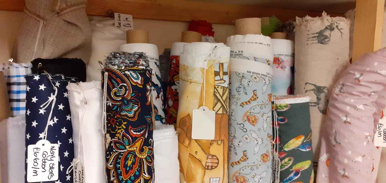 Large rolls of various fabric. Photo