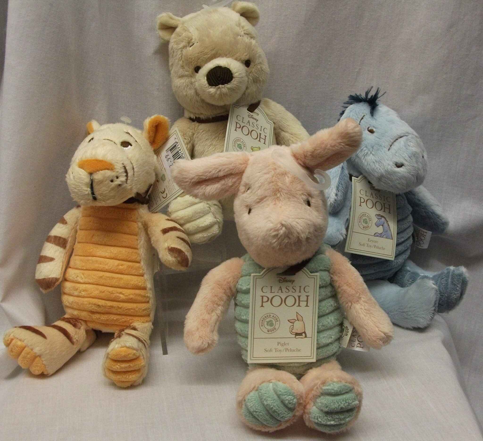 Winnie the Pooh, Tigger, Eeyore and Piglet stuffed toys. Photo