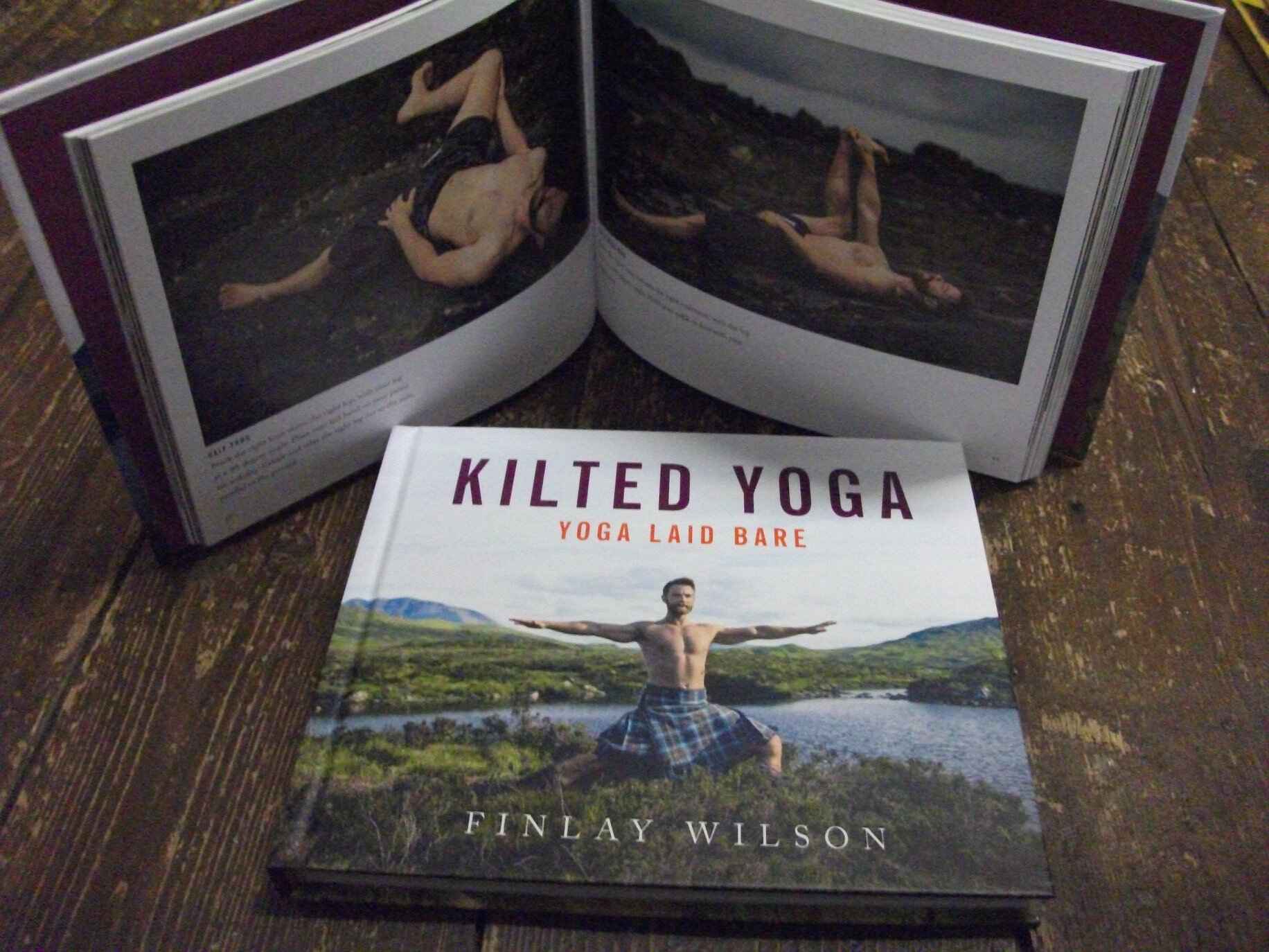 Kilted Yoga book with photo of man in kilt doing a yoga pose. Photo