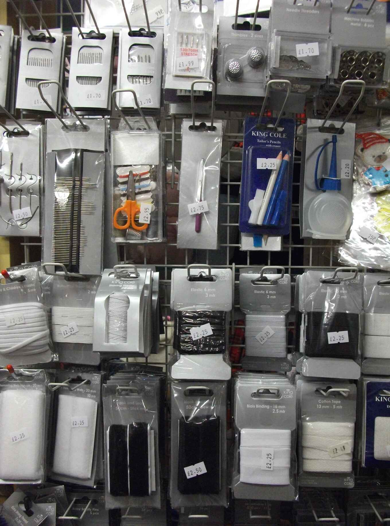 Shop display showing different knitting needles, scissors, eleastic and other tools for haberdashery. Photo